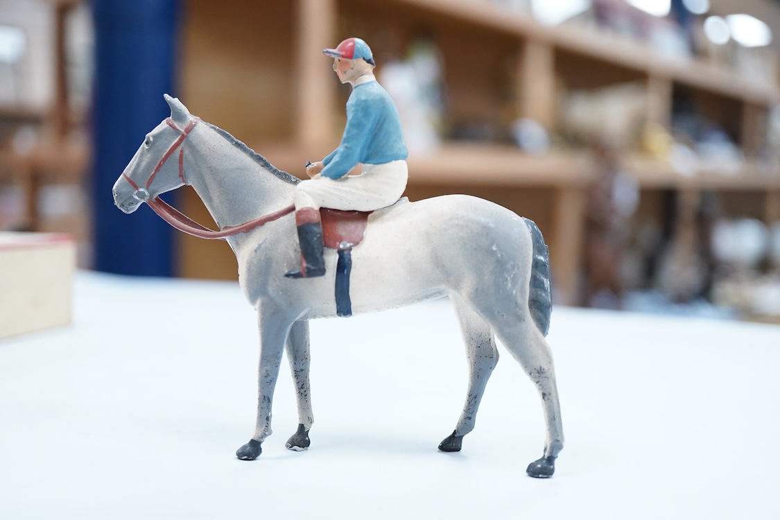 Two boxed Britains Racing Colours of Famous Owners series lead mounted figures; Lord Astor - rider in blue jersey with a pink sash on a grey horse (one leg broken and missing), and. the Duke of Norfolk - rider in blue je